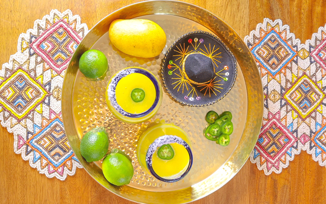 A plate with limes, limes, and a hat.